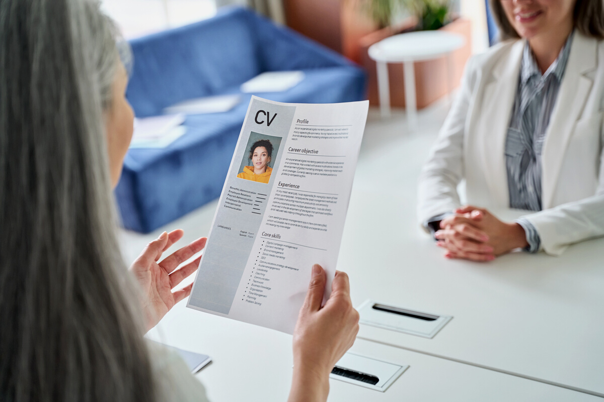 HR Manager Holding Cv Resume at Job Interview
